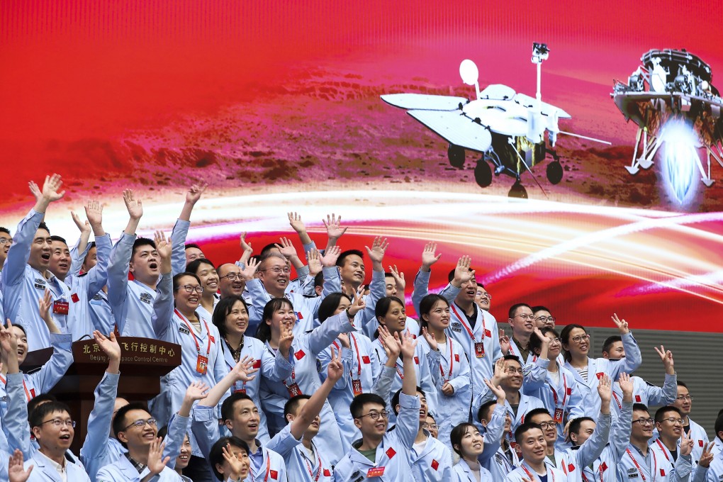 Staff at the Beijing Aerospace Control Centre celebrate after China’s Tianwen-1 probe successfully landed on Mars on May 15. Photo: Xinhua via AP