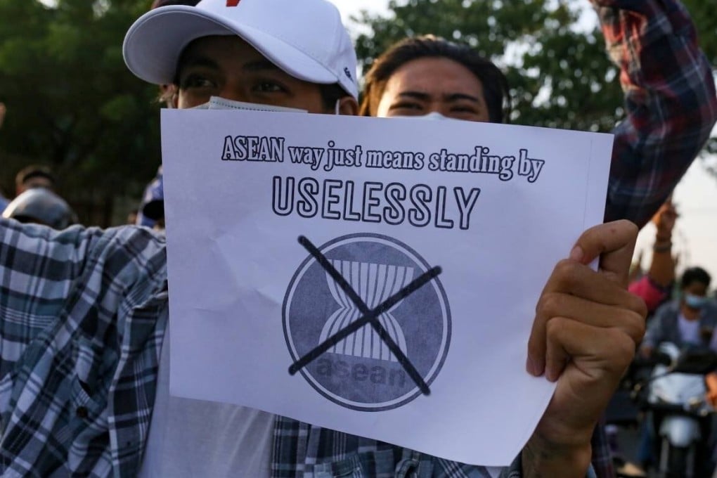 A protester against Myanmar's junta holds a placard criticising the Association of Southeast Asian Nations, during a demonstration in Mandalay on June 5. Photo: Reuters