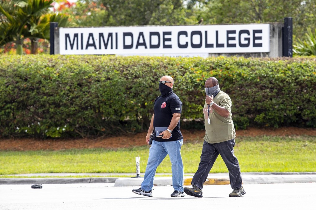 Detectives at the Miami-Dade Kendall Campus in Miami, Florida on Sunday after three people were killed and at least six injured following a shooting at a graduation party. Photo: AP