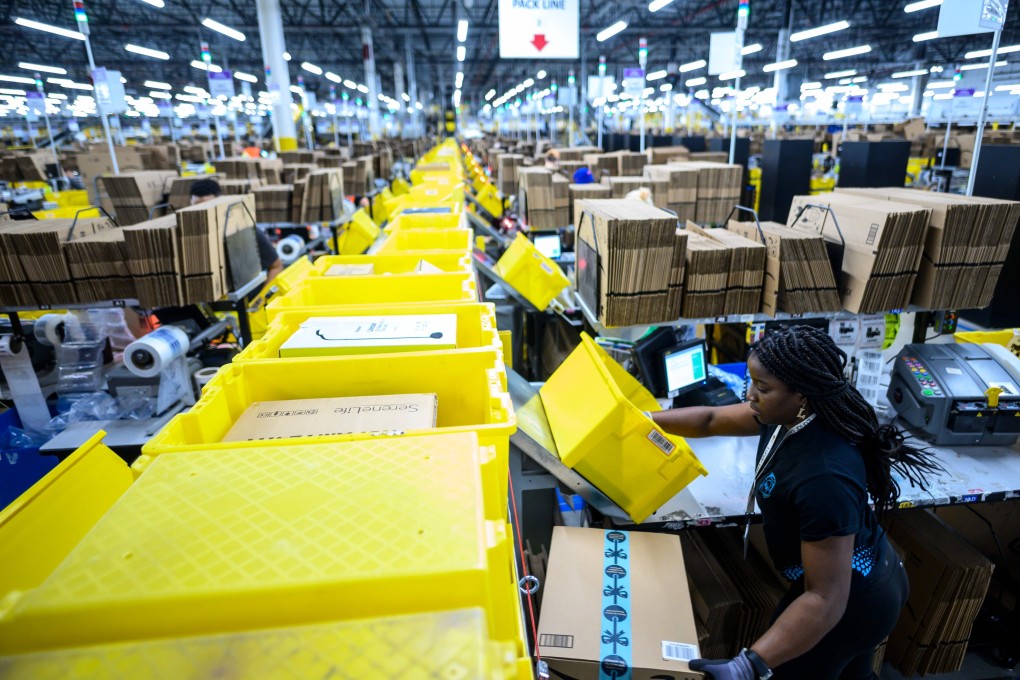A woman works at a packing station at the Amazon fulfilment centre in Staten Island, New York City, in February 2019. If there is a logistics real estate bubble in the making, it is not in Asia, but in the United States, where yields have fallen below those on offices. Photo: AFP
