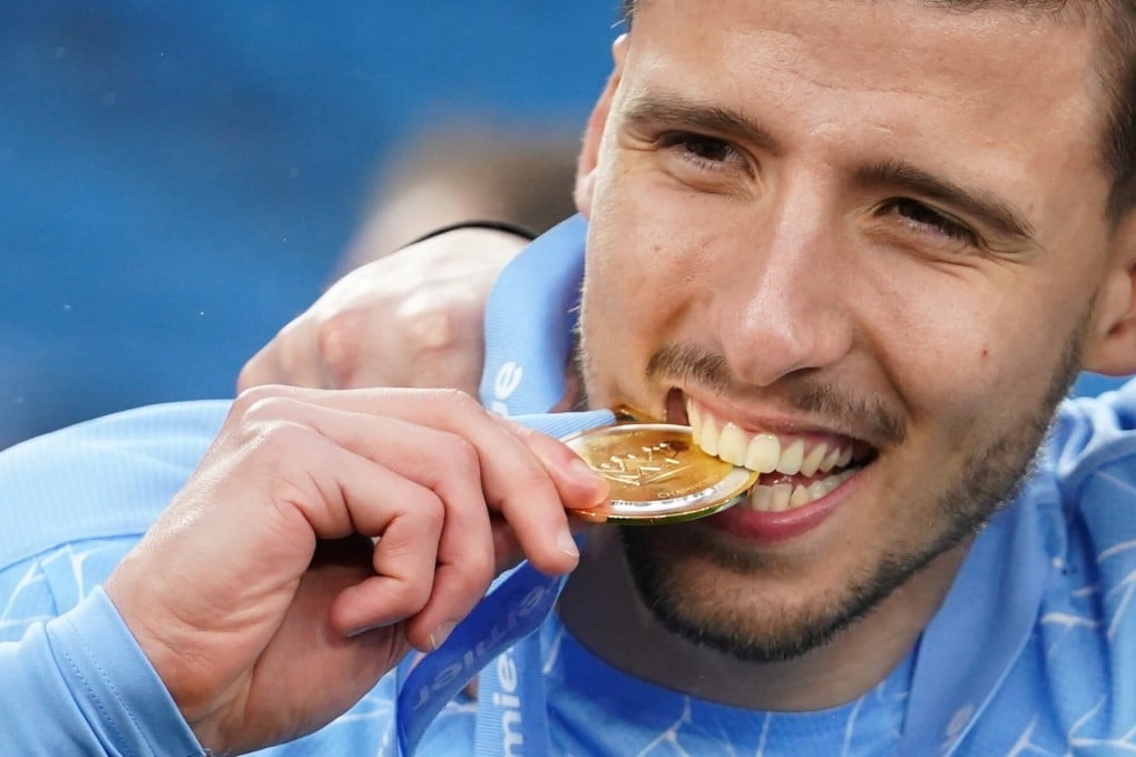 Ruben Dias of Manchester City celebrates during the Premier League trophy presentation. Photo: EPA