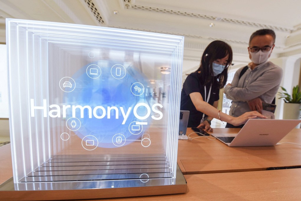 People try Huawei products with the HarmonyOS operating system at a Huawei store in Shanghai. Photo: AFP
