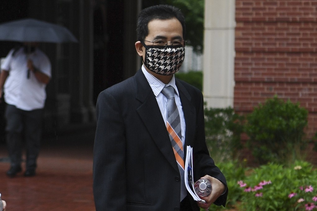 Hu Anming arrives at court in Knoxville, Tennessee, on Monday for the first day of his trial on charges of defrauding Nasa, which he denies. Photo: AP