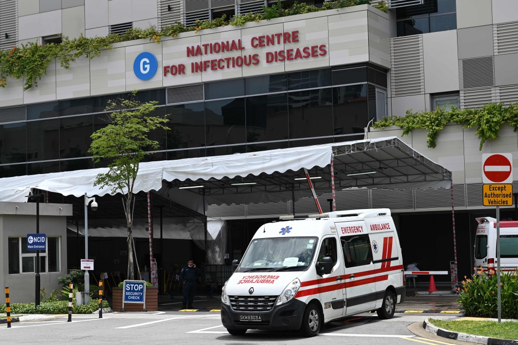 An ambulance leaves Singapore’s National Centre for Infectious Diseases, where patients suffering from Covid-19 are being treated. Photo: AFP