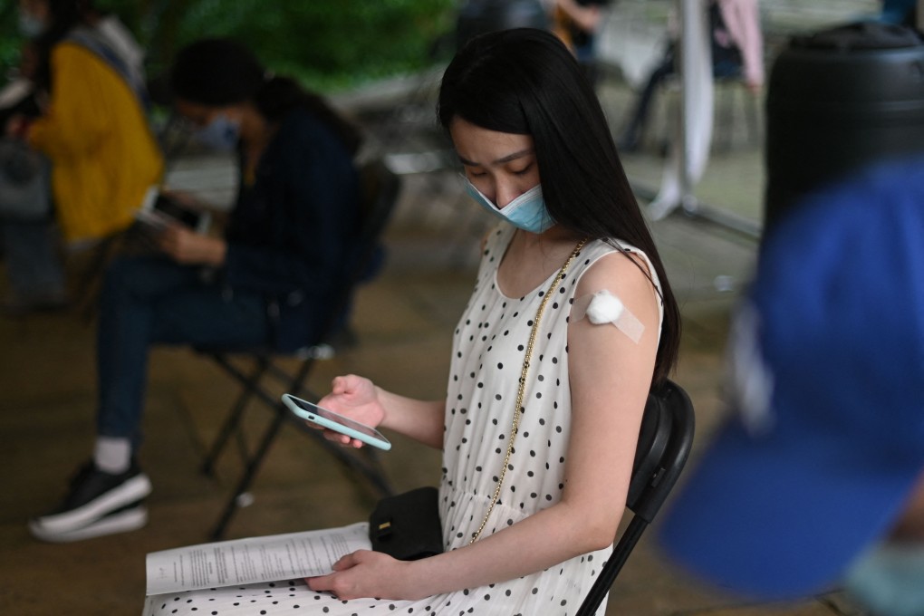A student at a vaccination centre in London. Photo: AFP