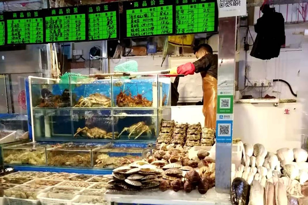 Store owners in Beijing’s Sanyuanli market have been dealing with weakened local demand since last year due to the coronavirus. Photo: Amanda Lee