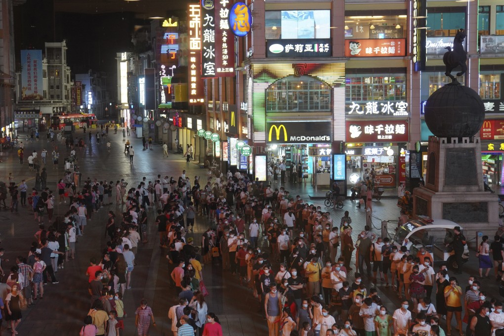 Residents line up for coronavirus testing in the Liwan District in Guangzhou in southern China's Guangdong province. Guangzhou has up to 23 qualified Covid-19 testing companies and institutes. Photo: AP Photo