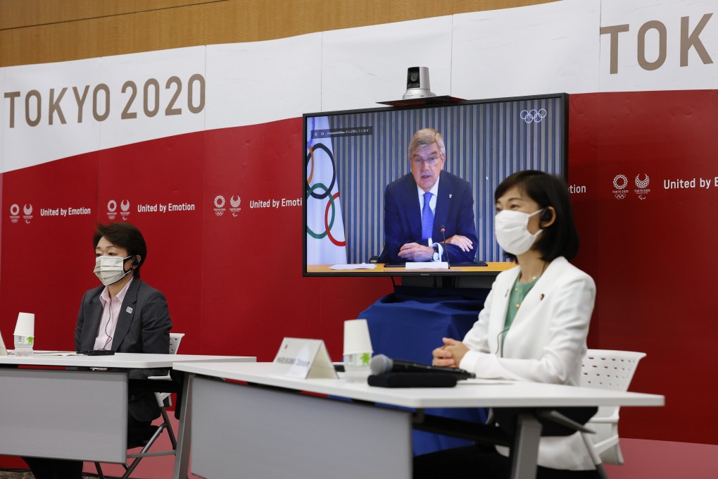 President of Tokyo 2020 Seiko Hashimoto, IOC President Thomas Bach (on screen) and Minister for the Tokyo Olympic and Paralympic Games, Tamayo Marukawa speak during a five-party meeting in Tokyo on June 21. Photo: EPA-EFE