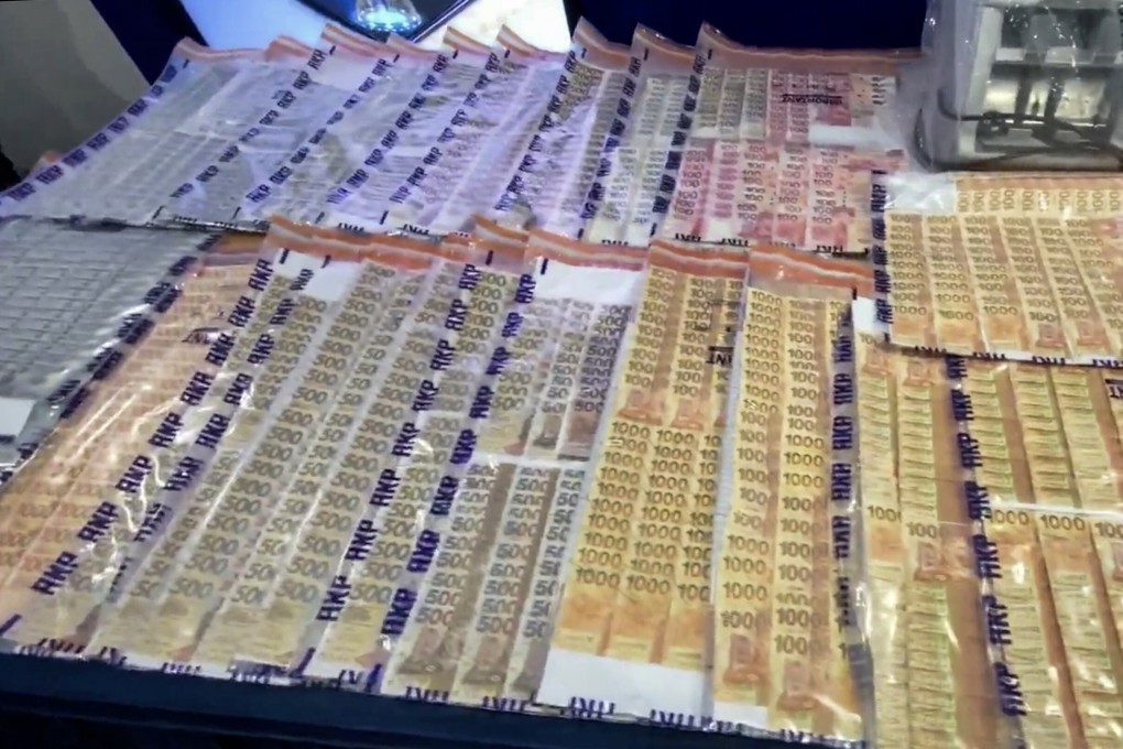 Money seized during the operation targeting a gang that laundered proceeds of romance scams. Photo: Handout