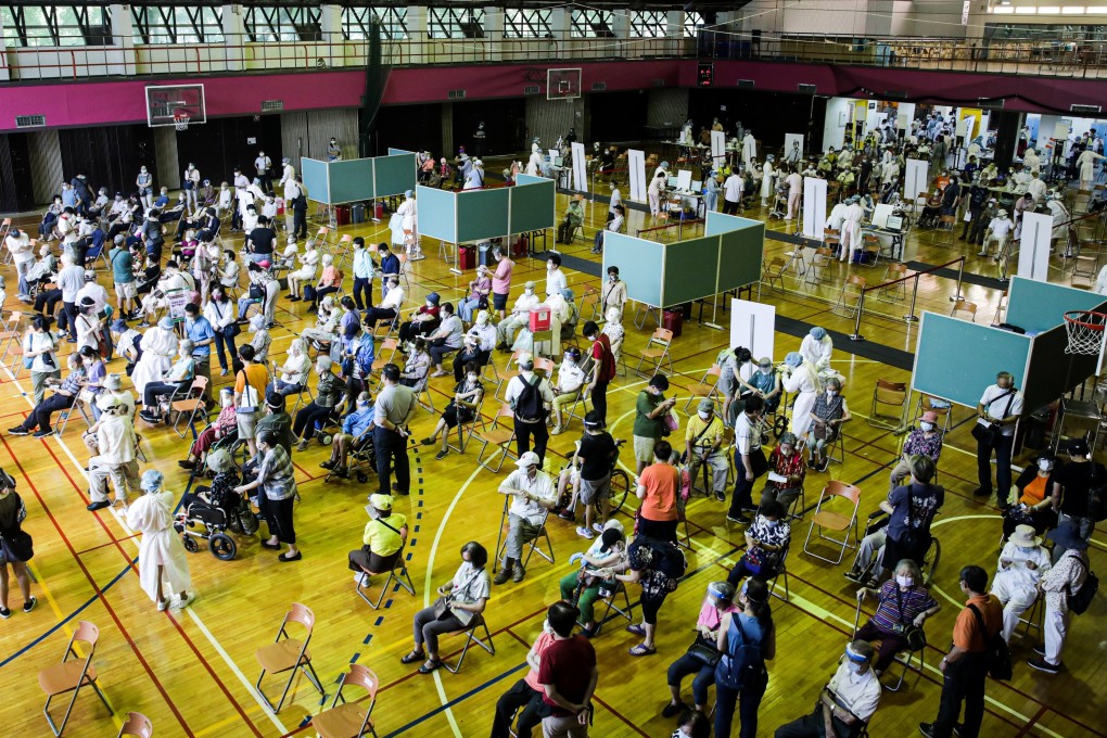 People in Taipei wait to be inoculated at a vaccination centre administering AstraZeneca vaccines donated by Japan, earlier this month. Photo: Bloomberg