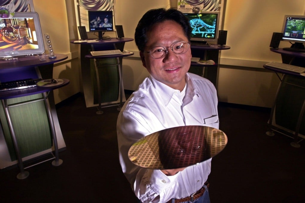 Nvidia Corp chief executive Jensen Huang holds up a silicon wafer at the company’s headquarters in Santa Clara, California. Huang said he has inoculated Nvidia from the worst of any potential crash caused by graphics card use and disposal in cryptocurrency mining. Photo: AP