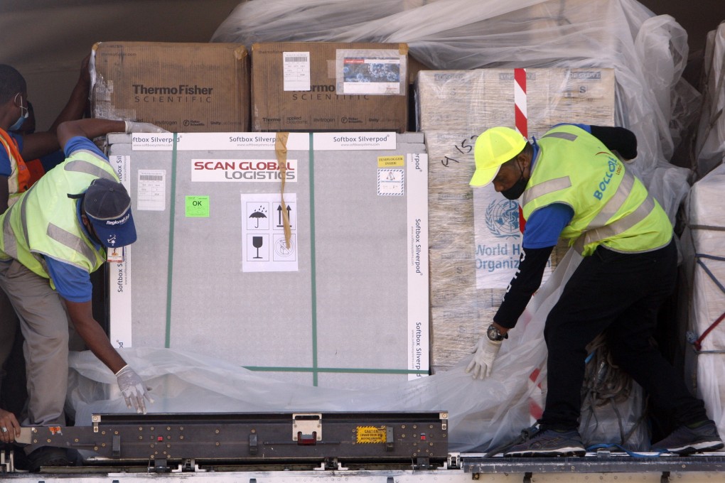 Workers in Dili, East Timor, unload AstraZeneca Covid-19 vaccines and medical supplies donated by the United States through the World Health Organization’s COVAX programme. Photo: EPA