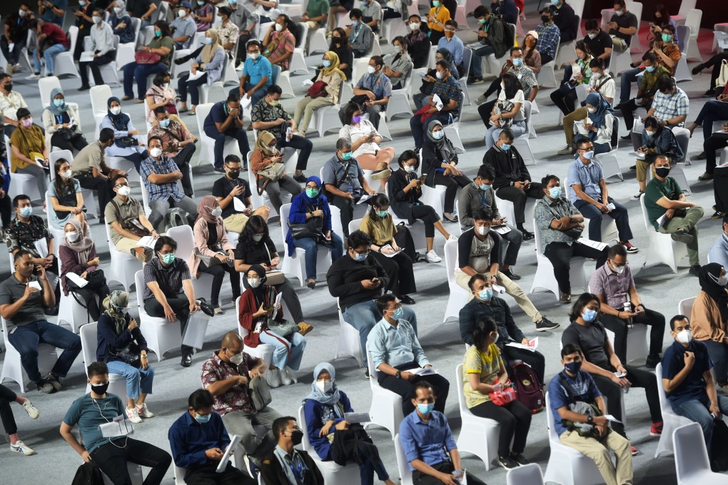 People wait to receive Covid-19 vaccines during a mass inoculation exercise in Jakarta, Indonesia. Photo: Xinhua