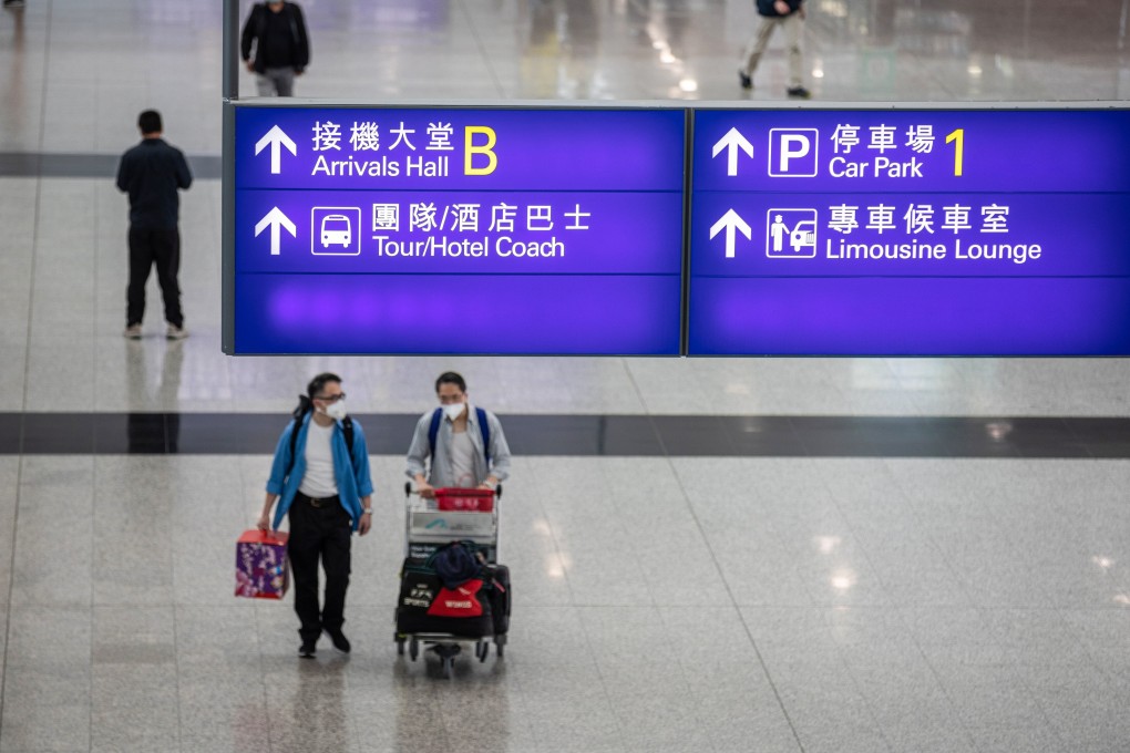 Passengers walk through the arrival hall at Hong Kong International Airport. Photo: EPA-EFE