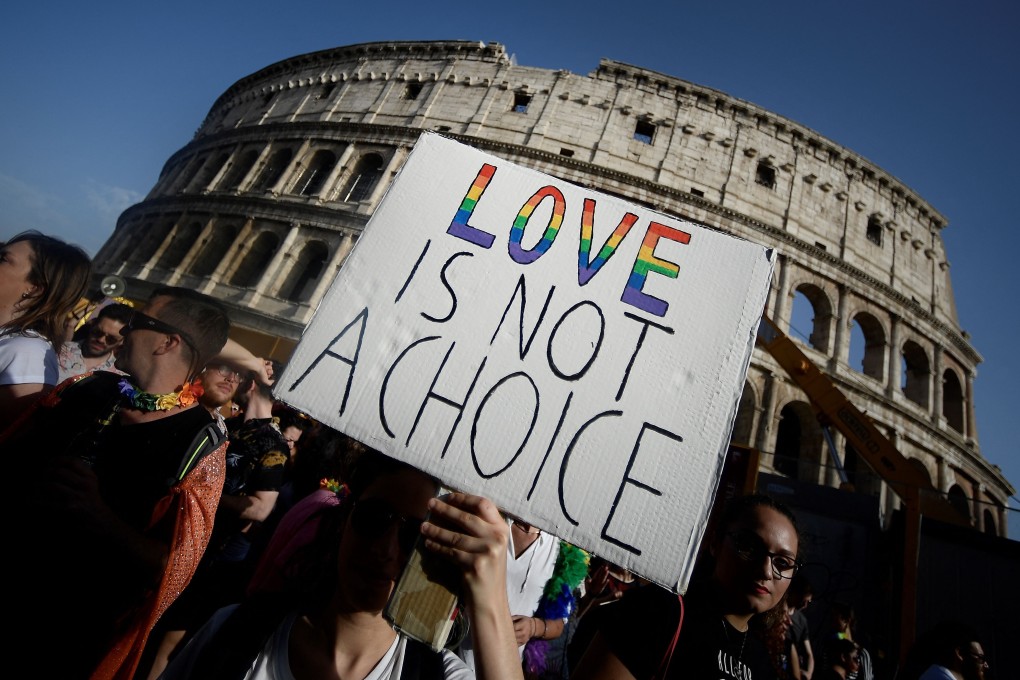 Participants in the annual Gay Pride parade pass the Colosseum in Rome. Photo: AFP