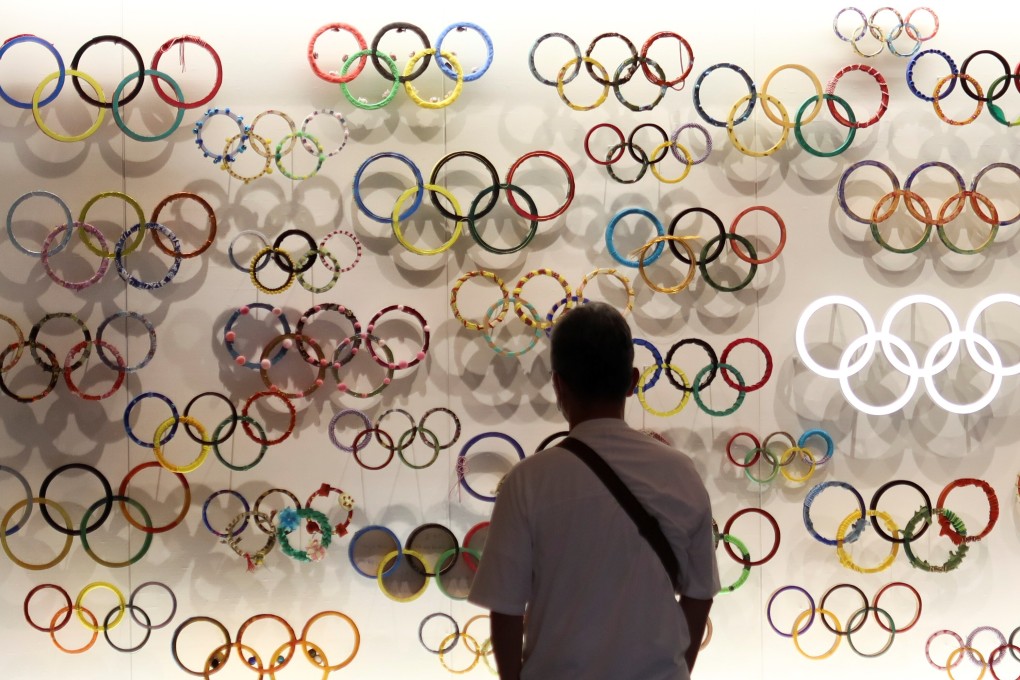 A man looks at the Olympic Rings at the Japanese Olympic Museum near the National Stadium in Tokyo, Japan. Photo: Reuters