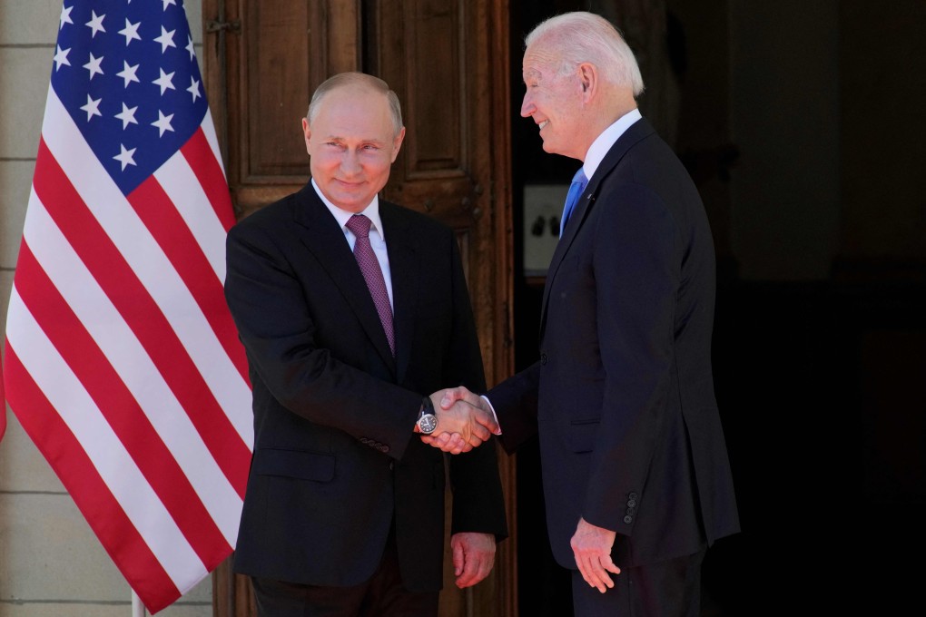 Russian President Vladimir Putin, left, shakes hands with US President Joe Biden during their meeting at the Villa La Grange in Geneva on June 16, 2021. Photo: Sputnik/AFP