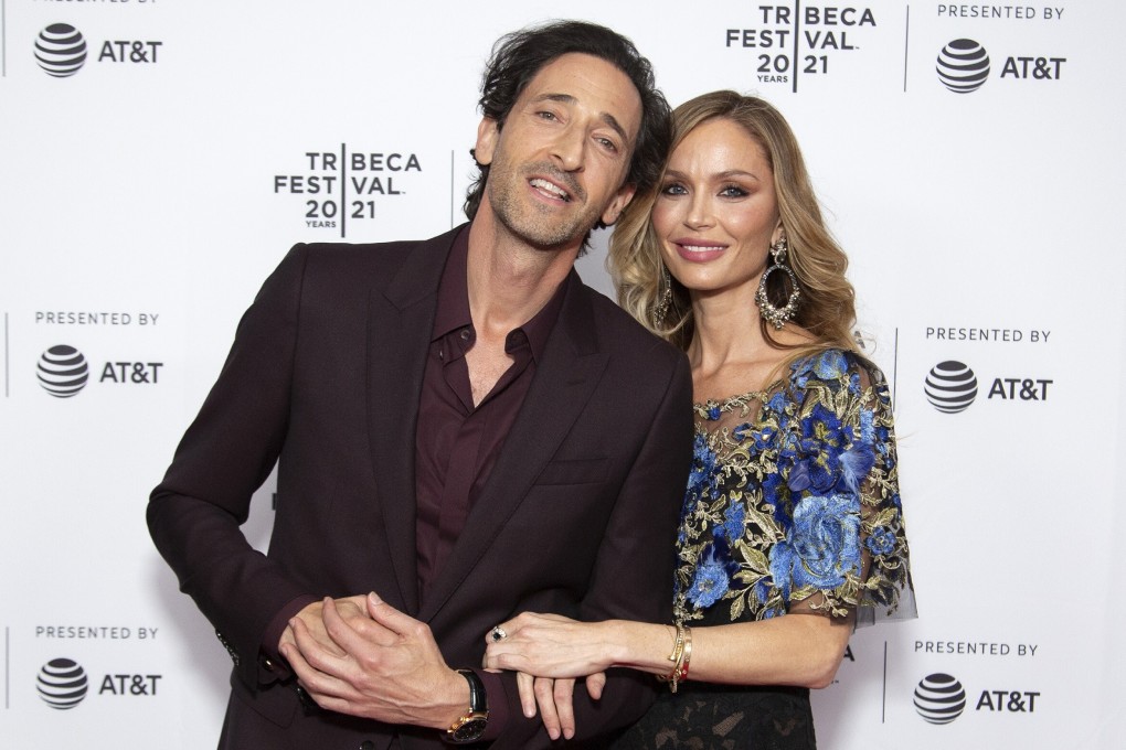 Adrien Brody, left, and Georgina Chapman. Photo: TNS