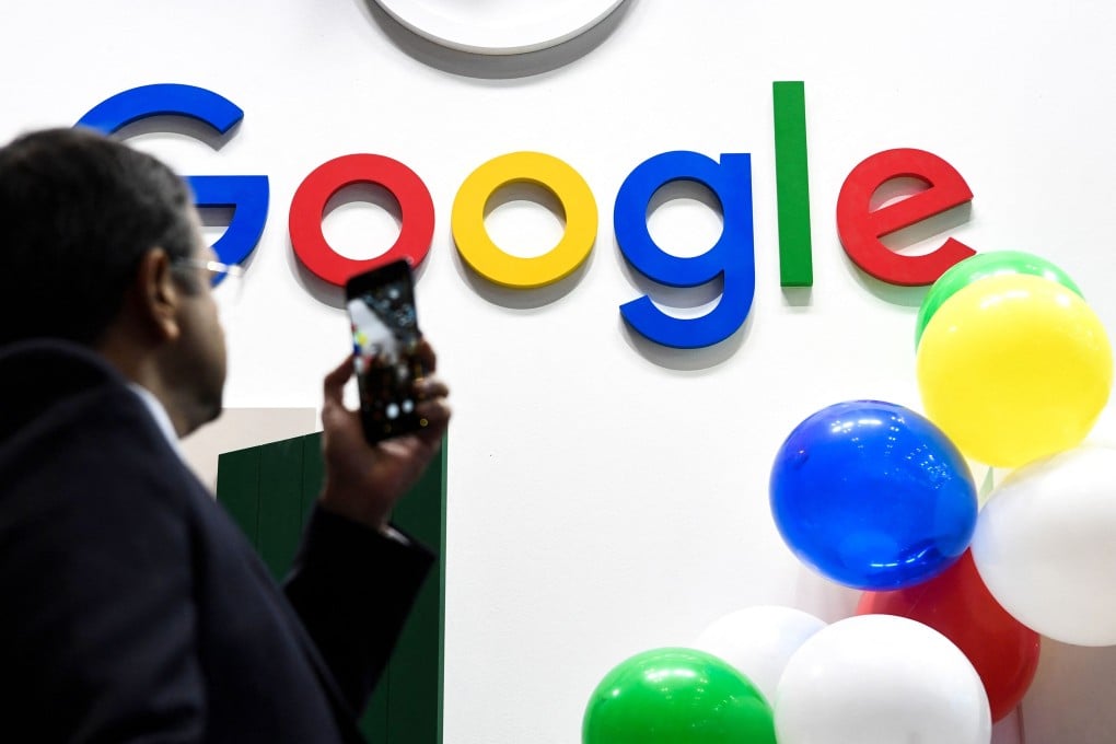 A man takes a picture with his mobile phone of the Google logo as he visits the Vivatech start-ups and innovation fair in Paris on May 16, 2019. Photo: AFP