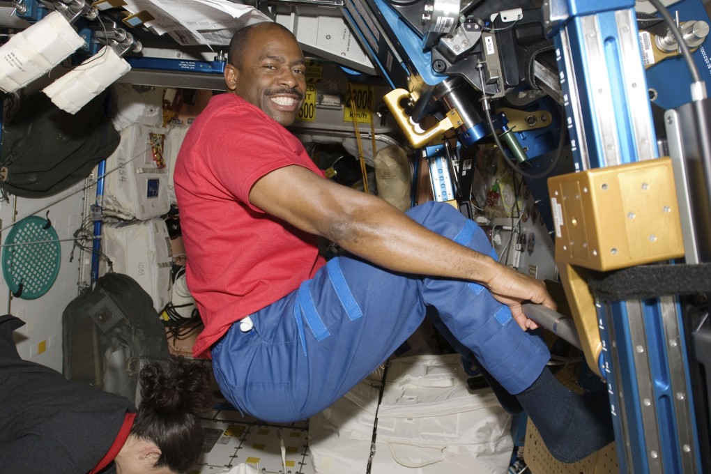 Astronaut Leland Melvin exercises in the Unity module of the International Space Station while the space shuttle Atlantis is docked with the station in 2009. Photo: Nasa via AP