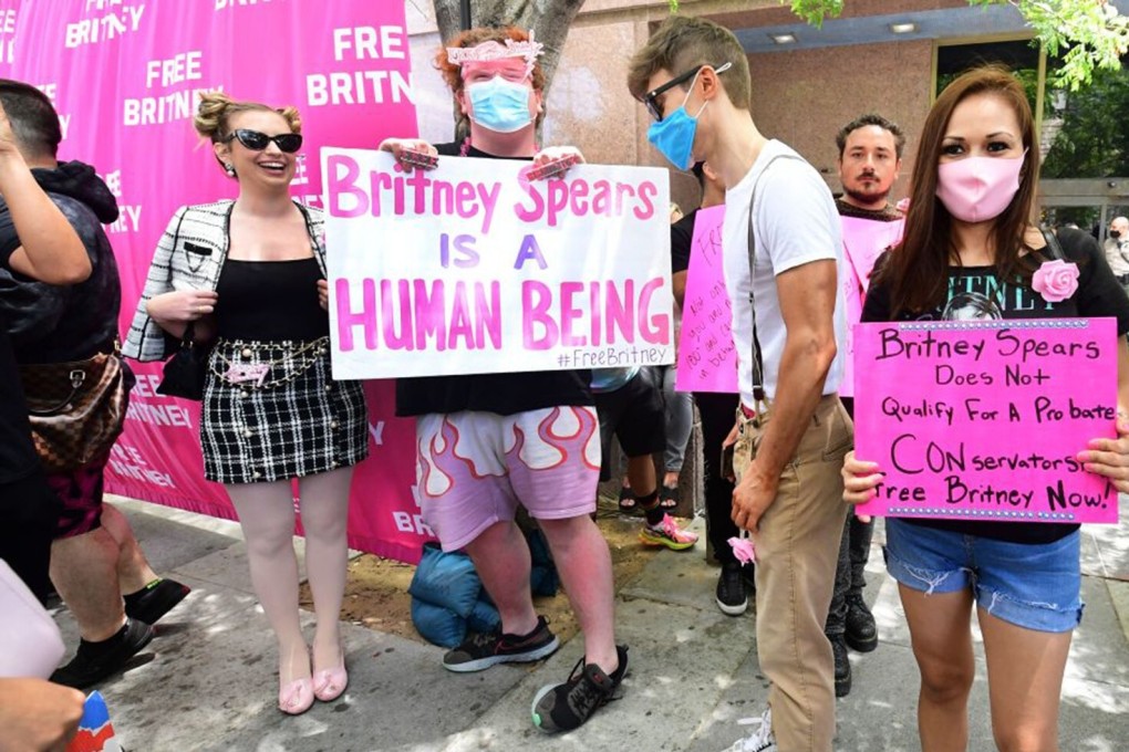Britney Spears supporters hold signs outside the County Courthouse in Los Angeles on Wednesday, during a scheduled hearing in Spears' conservatorship case. Photo: AFP via Getty Images / TNS