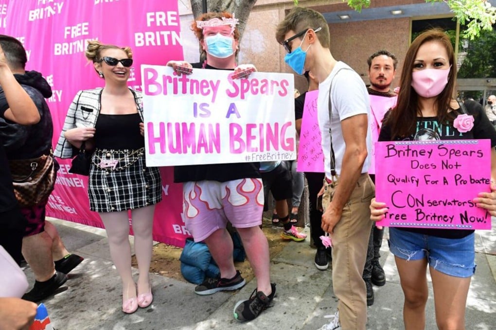 Britney Spears supporters hold signs outside the County Courthouse in Los Angeles on Wednesday, during a scheduled hearing in Spears' conservatorship case. Photo: AFP via Getty Images / TNS
