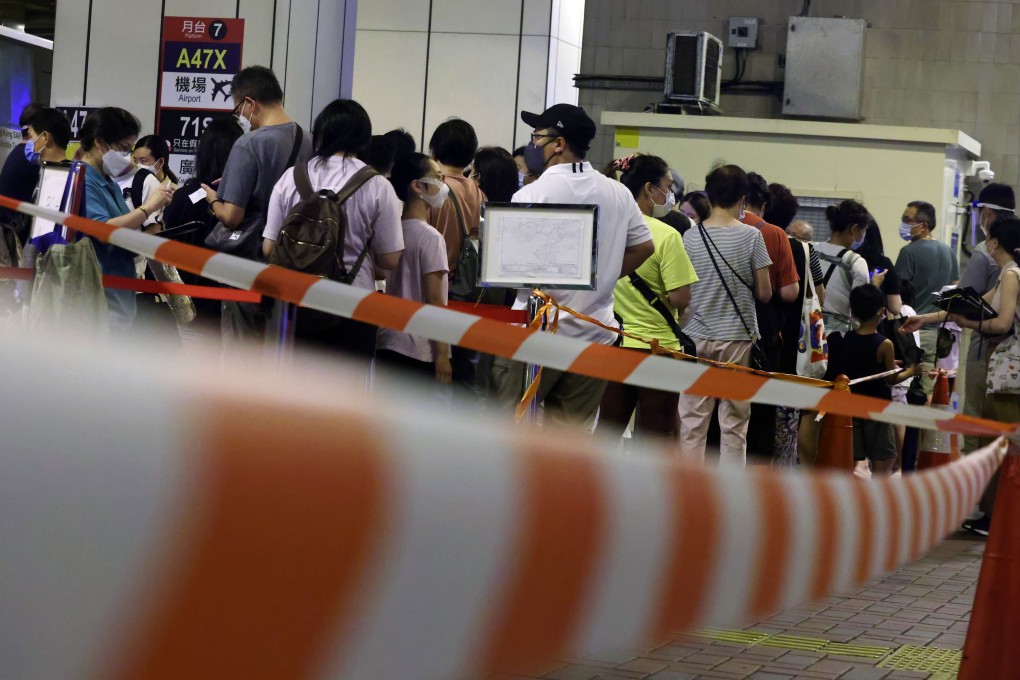 Residents queue for testing at a mobile specimen collection station at a transport interchange. Photo: K. Y. Cheng