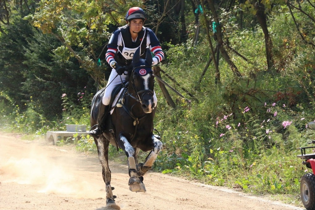 Hong Kong Olympian Thomas Heffernan Ho aboard Zibor, with whom he competed at the Asian Games. Photo: HKEF