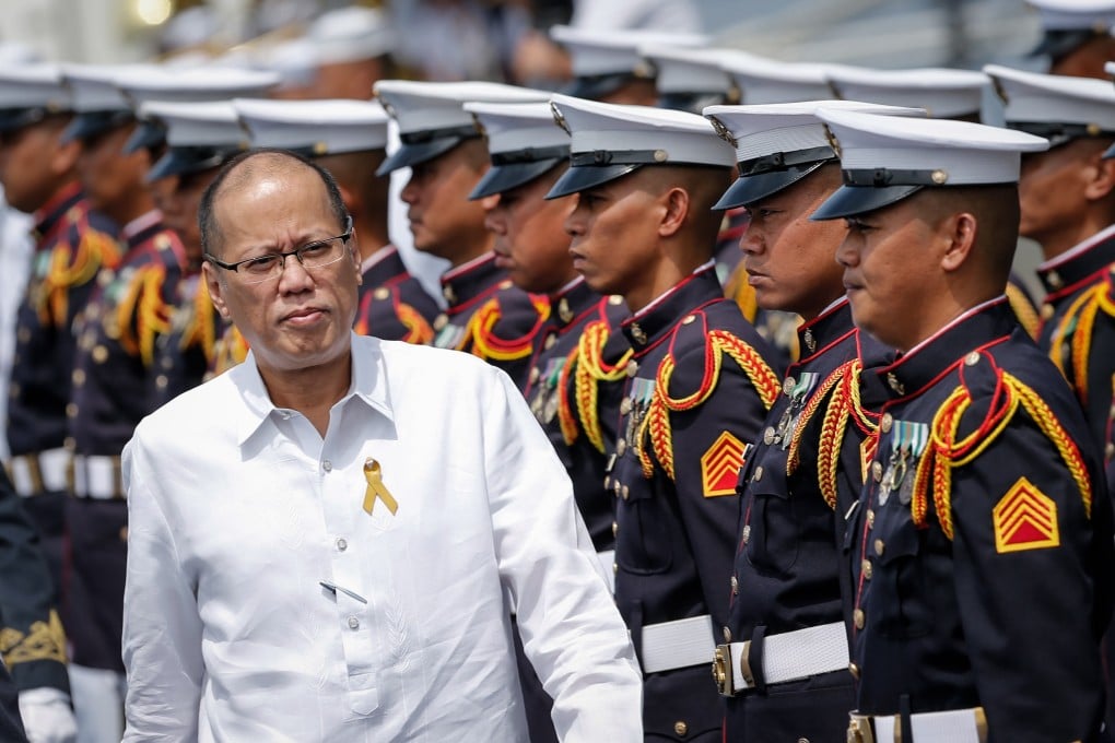 Benigno Aquino III reviews honour guards during the Philippine Navy’s 118th anniversary at a port in Manila, Philippines, in 2016. Photo: EPA
