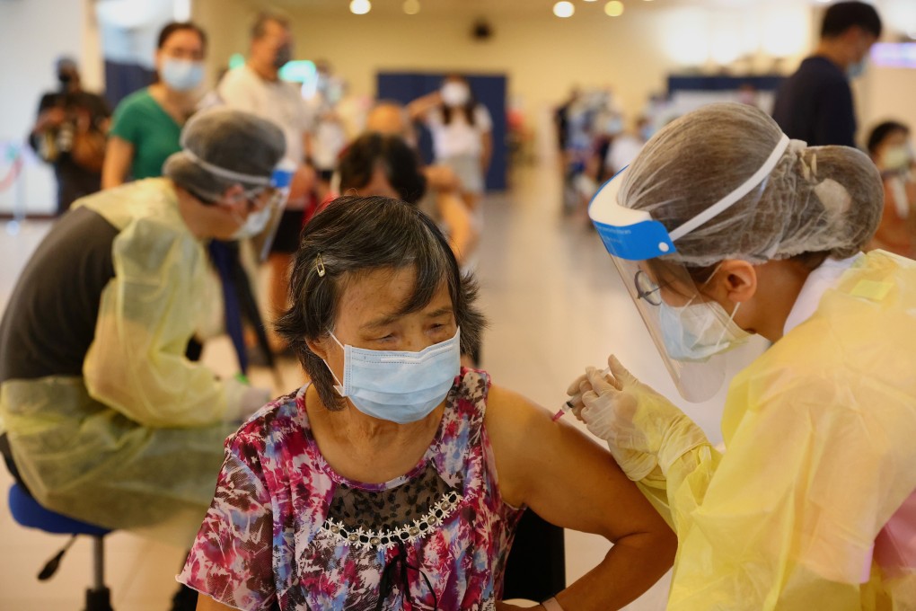 A resident gets vaccinated at a stadium in New Taipei on Friday. Taiwan is fighting its worst outbreak of Covid-19 since the pandemic began. Photo: Reuters