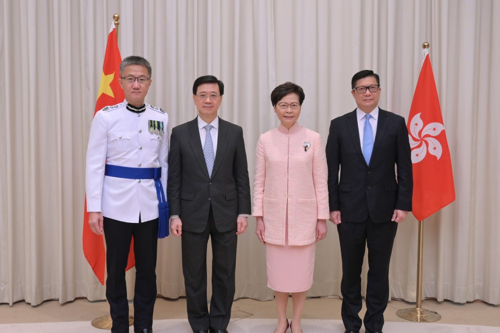 Hong Kong Chief Executive Carrie Lam (second right) with the new Chief Secretary, John Lee (second left), the new Secretary for Security, Tang Ping-keung (right), and the new Commissioner of Police, Siu Chak-yee, on June 24. Photo: Handout