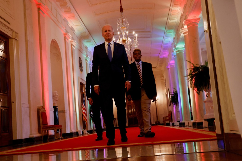 US President Joe Biden and LGBTQ advocate Ashton Mota of the GenderCool Project in the White House, Washington on Friday. Photo: Reuters