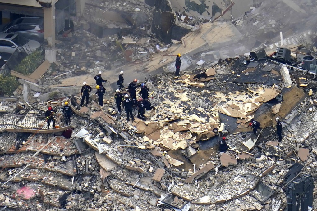Rescuers search in the rubble at the Champlain Towers South condominium in Surfside, Miami. Photo: AP
