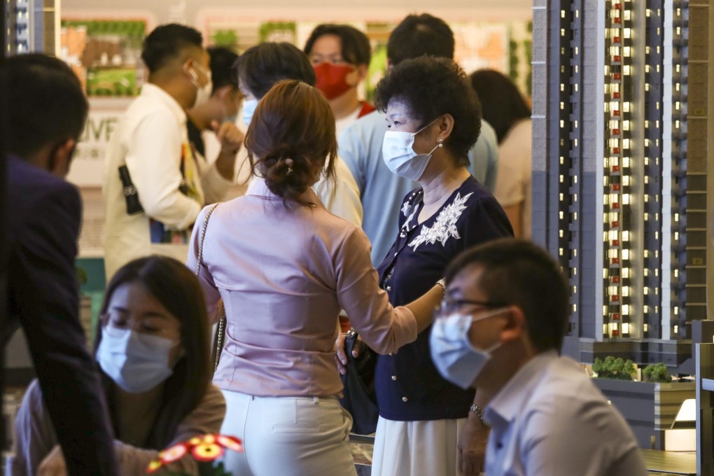 Customers vying for CK Asset Holdings’ Seaside Sonata apartments in CheunG Sha Wan at the developer’s sales office at the Fortune Metropolis in Hung Hom on June 26, 2021. Photo: Jonathan Wong