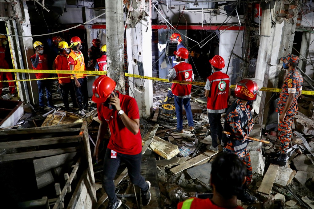 Rescuers at the site of an explosion in a shop that killed seven and injured dozens of people in Dhaka, Bangladesh on Sunday. Photo: Reuters