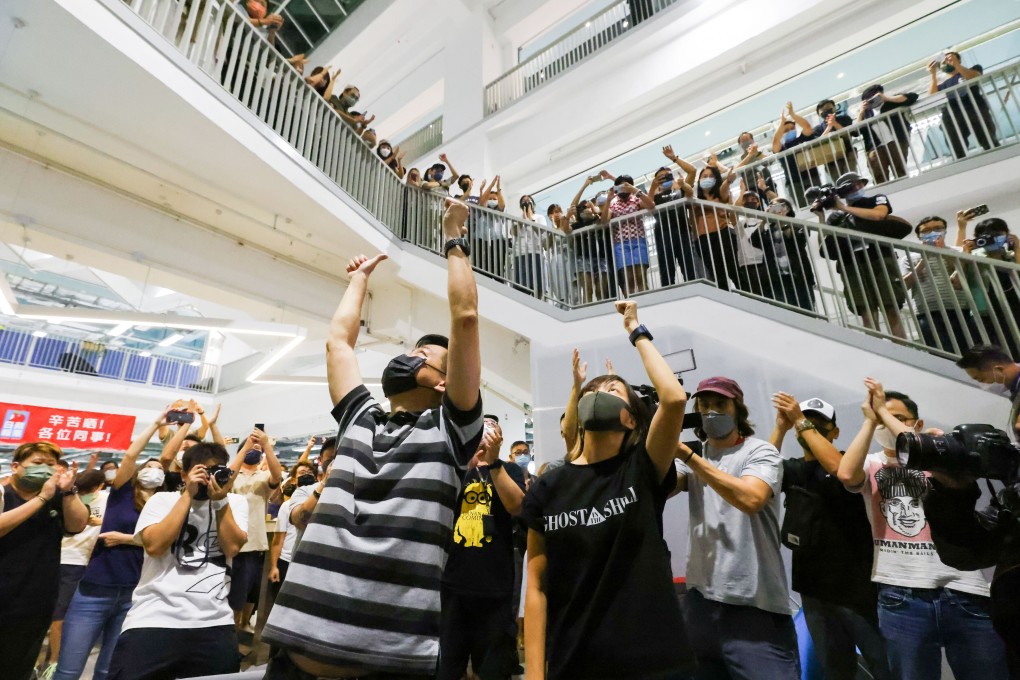 Apple Daily staff mark the final edition in the 26-year history of the newspaper. Photo: Dickson Lee