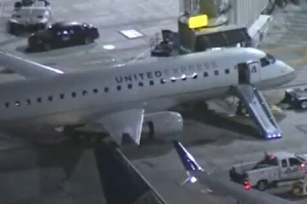 The male passenger opened the plane’s emergency exit and jumped to the tarmac at Los Angeles International Airport, breaking his leg. Photo: CBSLA