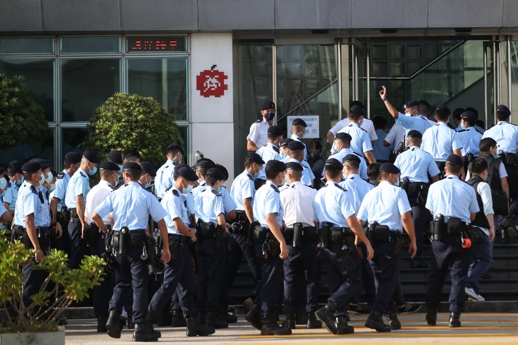 Police officers set up a cordon outside Next Digital’s offices in Tseung Kwan O during a raid on June 17. Photo: Winson Wong