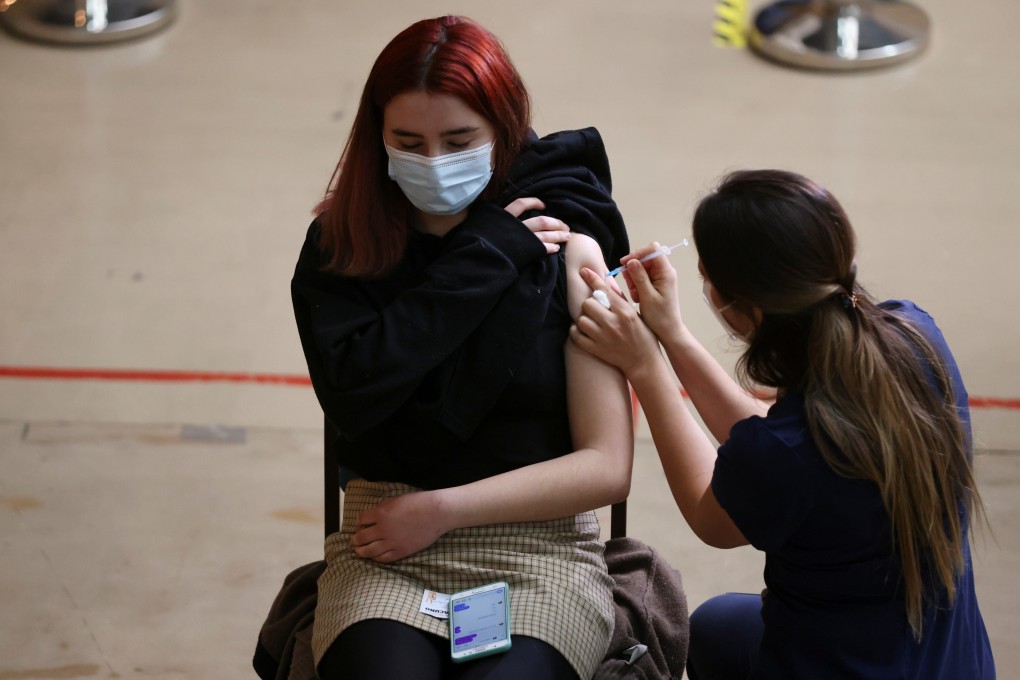 A woman receives a dose of the Pfizer Covid-19 vaccine in Santiago, Chile. Photo: Reuters