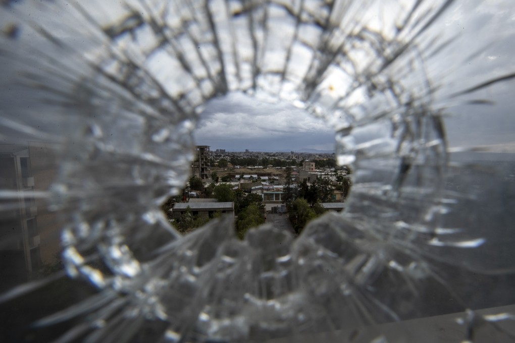 Mekelle, capital city of Ethiopia’s war-torn Tigray region, as seen through a hospital window smashed by a bullet. Photo: AP