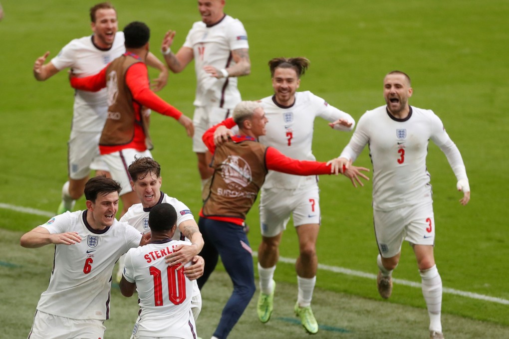 England’s Raheem Sterling celebrates scoring the first goal against Germany with teammates at Wembley Stadium in London on Tuesday. Photo: Reuters