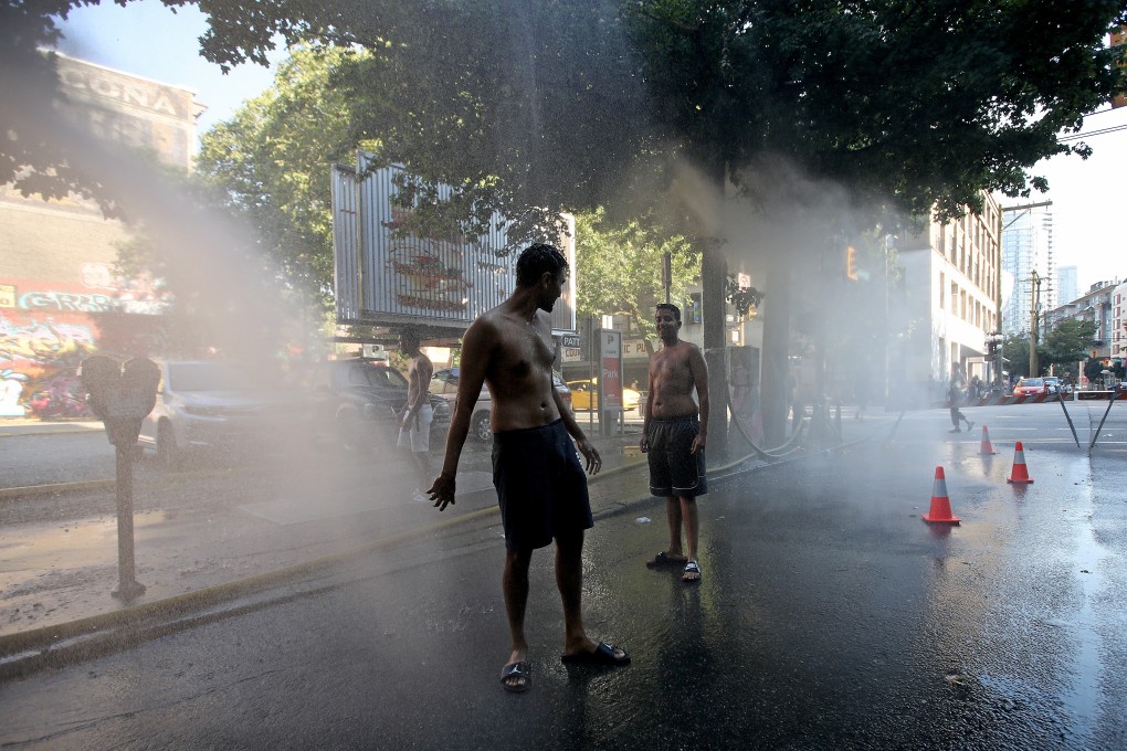 Vancouver has set up temporary water fountains and misting stations on street corners. Photo: Bloomberg