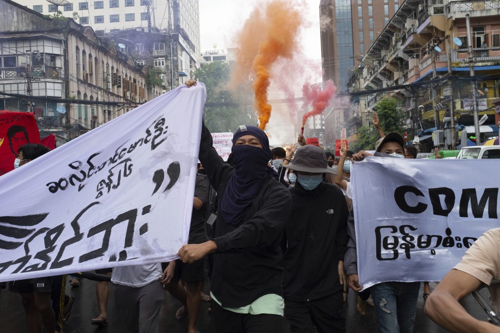 Anti-coup protesters march in Pabedan township near Yangon. Photo: AP