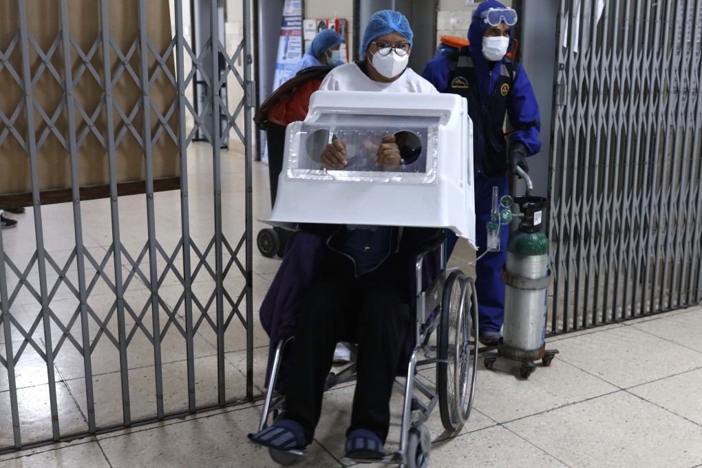 A Covid-19 patient in Peru wears a protective covering. Photo: AP