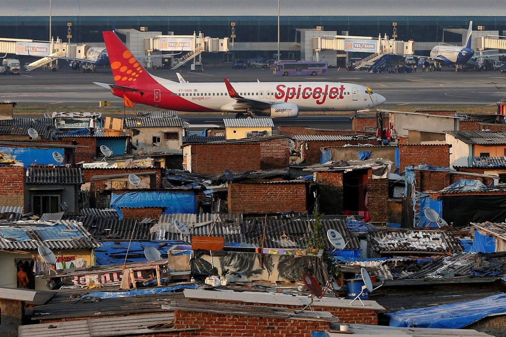 A passenger aircraft bearing SpiceJet’s livery on the runway at the Mumbai airport on December 19, 2014. Photo: Reuters