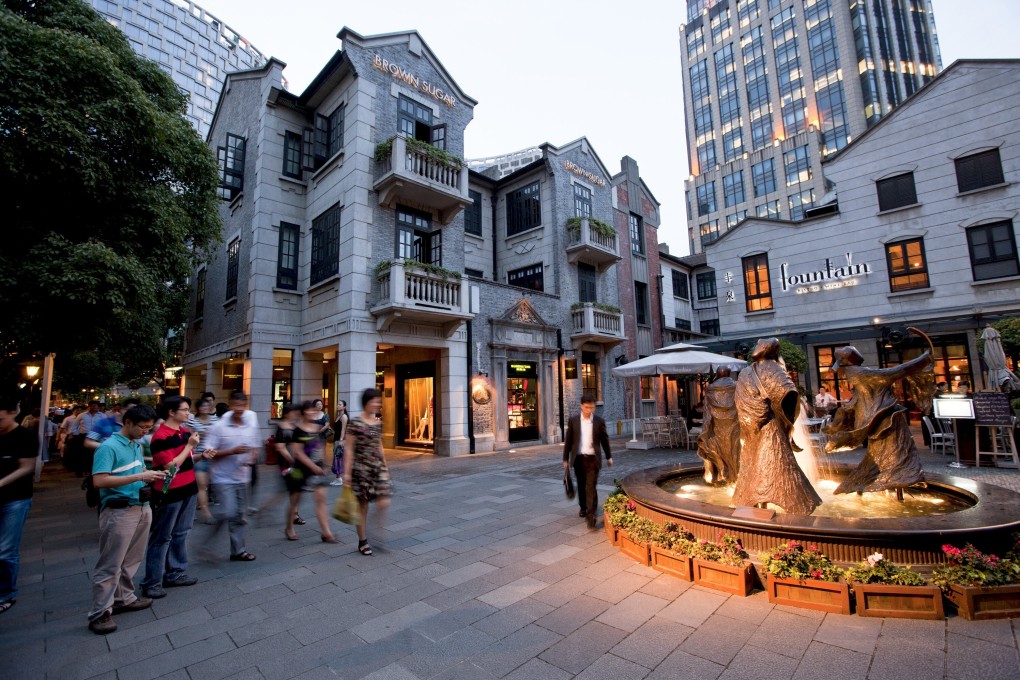 Visitors walk at Xintiandi in Shanghai, China. Photo: Bloomberg