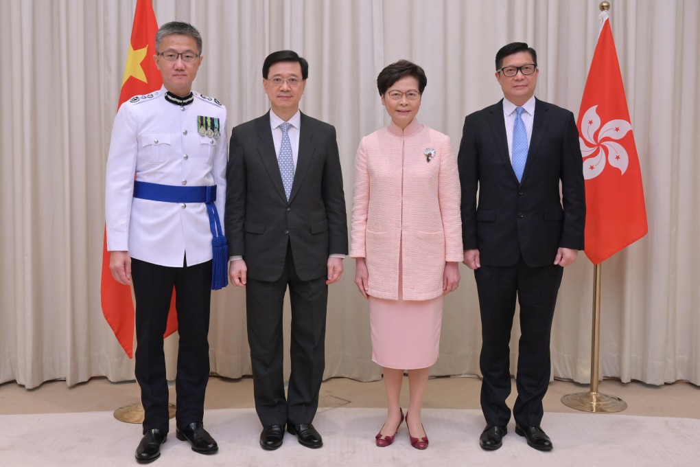 Hong Kong leader Carrie Lam, flanked by her newly appointed officials. Photo: Handout