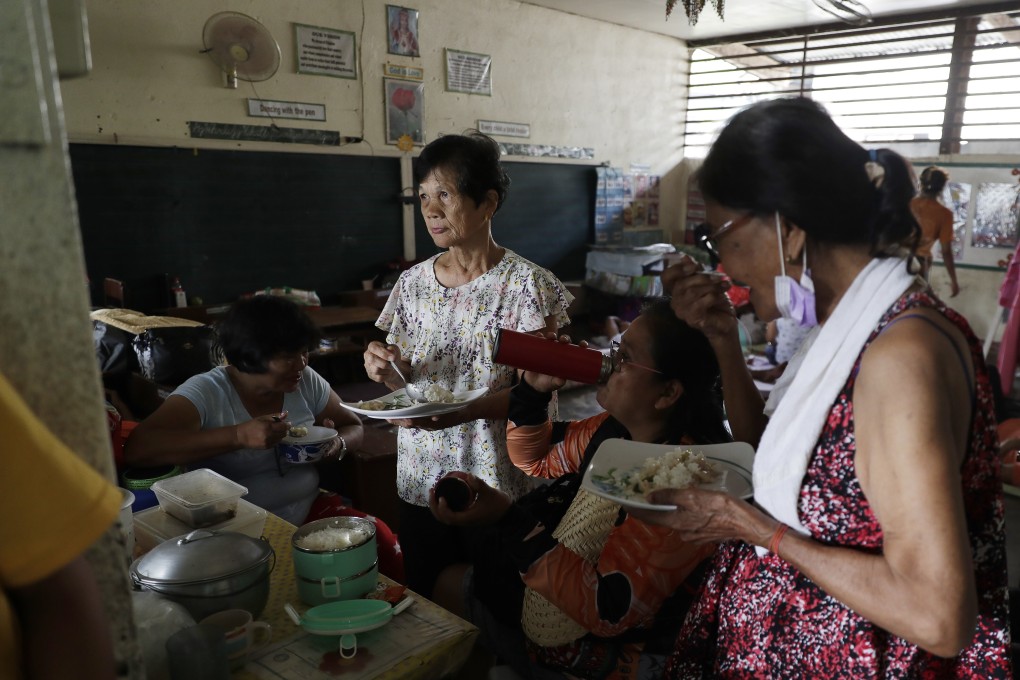 Residents who fled their homes at an evacuation centre in Laurel, Batangas province, Philippines. Photo: AP