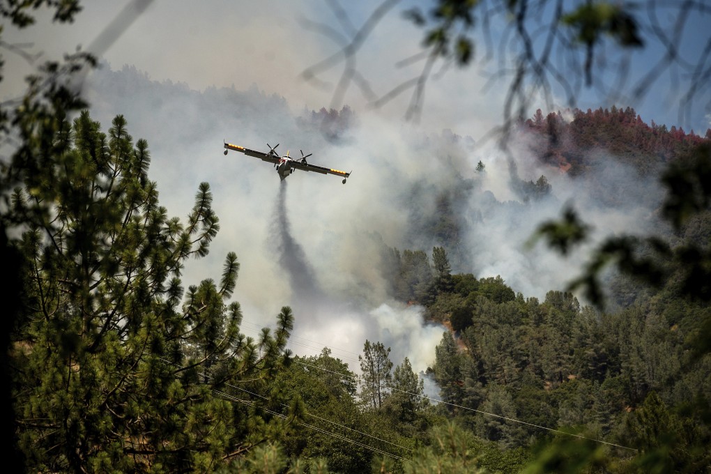 An air tanker drops fire retardant on the Salt Fire in Lakehead, California on Thursday. Photo: AP