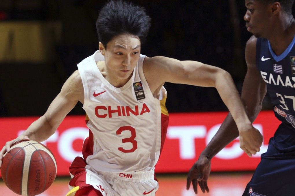 China’s Hu Mingxuan drives past Greece’s Kostas Antetokounmpo in their FIBA men’s Olympic basketball qualifier. Photo: AP